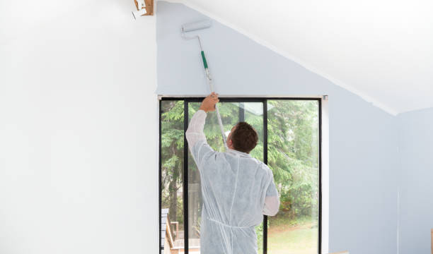 istock Man painting interior of home with roller 1020375326