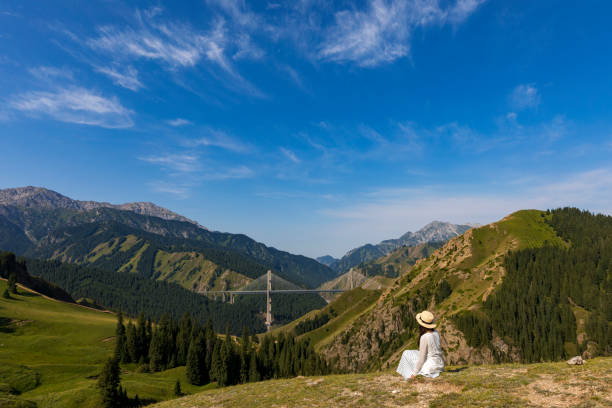 A female traveller was in the canyon, xinjiang province, China.