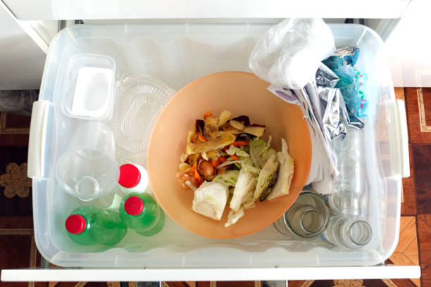 istock sorting of garbage types. Waste management concept. Top view.  Conceptual image for environmental pollution and consumerism 1020382970