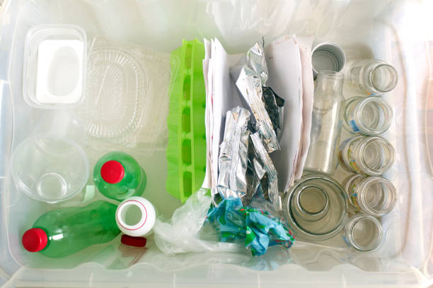istock sorting of garbage types. Waste management concept. Top view.  Conceptual image for environmental pollution and consumerism 1020382980