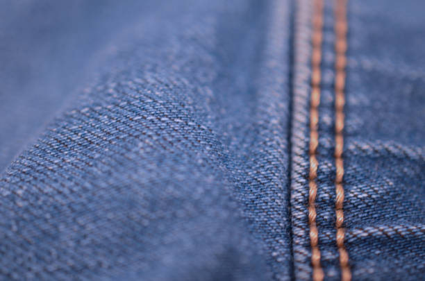 istock blue texture maden from a piece of jeans blurred toned. 1020391046