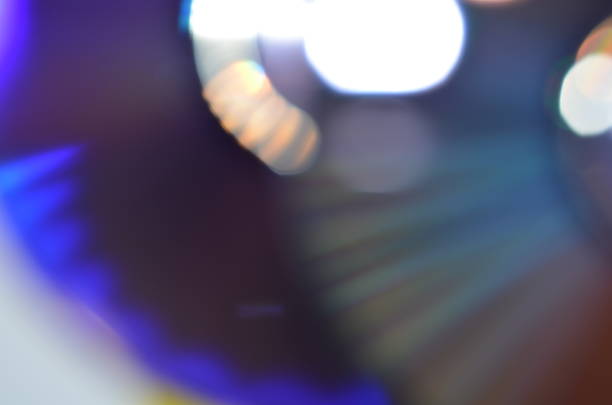 istock abstract colorful bokeh background received from the light of lamp on CD disk with glitter, defocused. 1020394072