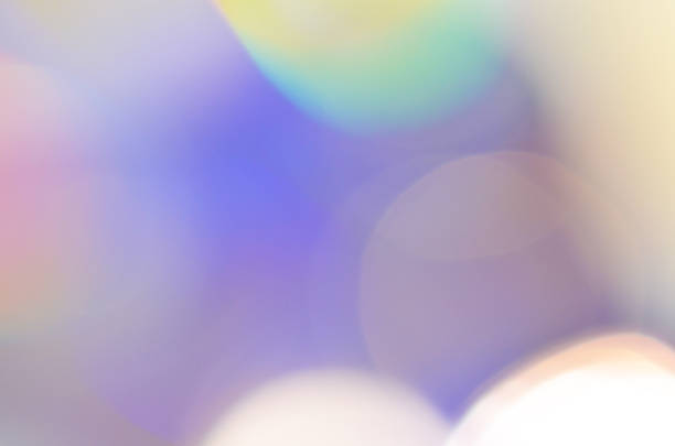 istock abstract colorful bokeh background received from the light of lamp on CD disk with glitter, defocused. 1020395440