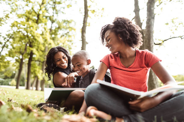 istock family doing the homework in the park 1020396062