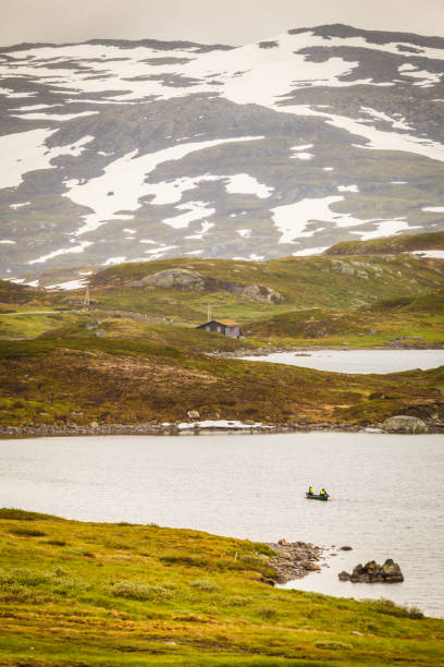 istock People canoeing in lake 1020399038