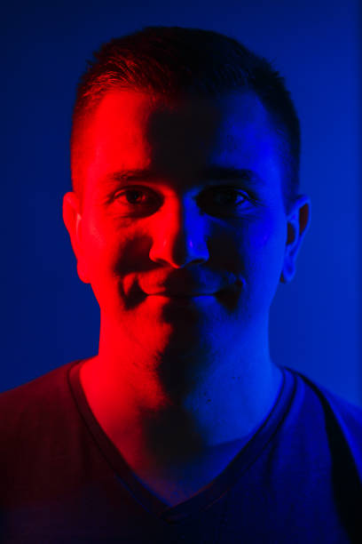 istock young man close head portrait red blue double colors light 1020403050