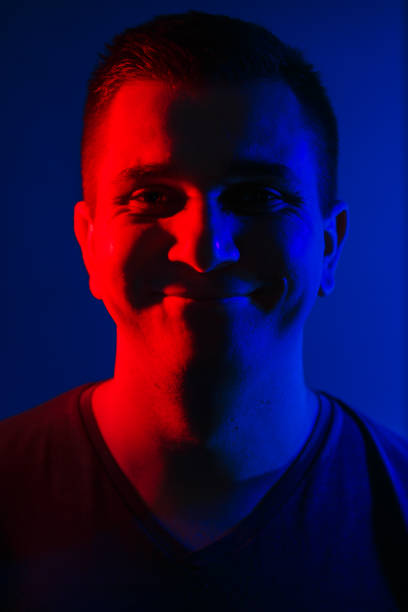 istock young man close head portrait red blue double colors light 1020403368