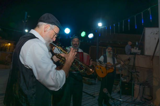 Klezmer Festival (2018) in Safed (Tzfat) Safed, Israel - August 14, 2018: Scene of the Klezmer Festival, with street musicians playing, in Safed (Tzfat), Israel. Its the 31st annual traditional Jewish festival in the public streets of Safed klezmer stock pictures, royalty-free photos & images