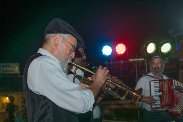 Klezmer Festival (2018) in Safed (Tzfat) Safed, Israel - August 14, 2018: Scene of the Klezmer Festival, with street musicians playing, in Safed (Tzfat), Israel. Its the 31st annual traditional Jewish festival in the public streets of Safed klezmer stock pictures, royalty-free photos & images