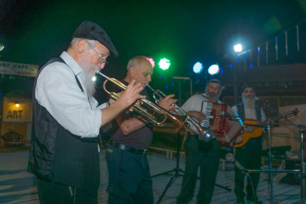 Klezmer Festival (2018) in Safed (Tzfat) Safed, Israel - August 14, 2018: Scene of the Klezmer Festival, with street musicians playing, in Safed (Tzfat), Israel. Its the 31st annual traditional Jewish festival in the public streets of Safed klezmer stock pictures, royalty-free photos & images