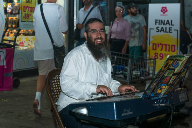 Klezmer Festival (2018) in Safed (Tzfat) Safed, Israel - August 14, 2018: Scene of the Klezmer Festival, with street musician and crowd, in Safed (Tzfat), Israel. Its the 31st annual traditional Jewish festival in the public streets of Safed klezmer stock pictures, royalty-free photos & images