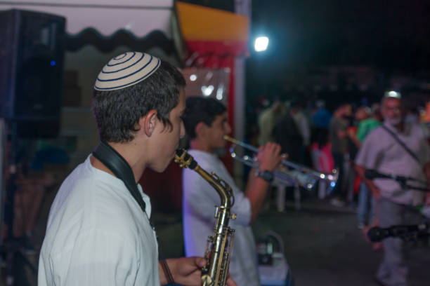 Klezmer Festival (2018) in Safed (Tzfat) Safed, Israel - August 14, 2018: Scene of the Klezmer Festival, with street musicians and crowd. Safed (Tzfat), Israel. Its the 31st annual traditional Jewish festival in the public streets of Safed klezmer stock pictures, royalty-free photos & images