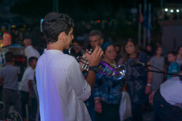 Klezmer Festival (2018) in Safed (Tzfat) Safed, Israel - August 14, 2018: Scene of the Klezmer Festival, with street musicians and crowd. Safed (Tzfat), Israel. Its the 31st annual traditional Jewish festival in the public streets of Safed klezmer stock pictures, royalty-free photos & images