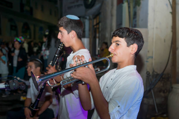 Klezmer Festival (2018) in Safed (Tzfat) Safed, Israel - August 14, 2018: Scene of the Klezmer Festival, with street musicians and crowd. Safed (Tzfat), Israel. Its the 31st annual traditional Jewish festival in the public streets of Safed klezmer stock pictures, royalty-free photos & images