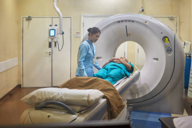 istock Nurse Assisting Patient During Cat Scan Exam 1020431384
