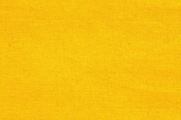 fundo de textura de tecido algodão amarela, padrão sem costura de têxteis naturais. - embroidery canvas beige close up - fotografias e filmes do acervo