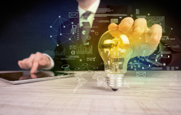 istock businessman holding glowing glass light bulb 1020444168