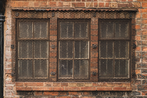 Barred windows, seen in Shrewsbury, Shropshire, England, UK