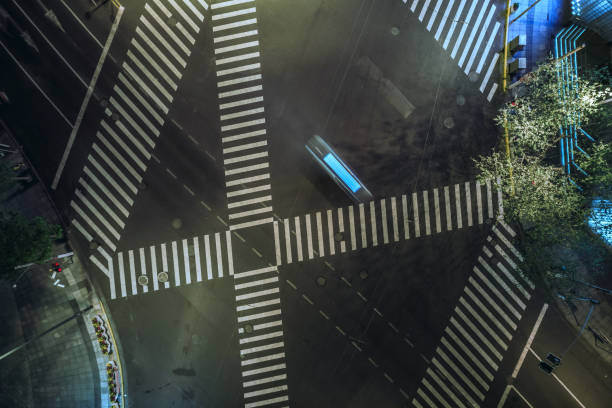 istock Aerial drone view on city intersection during night 1020448420