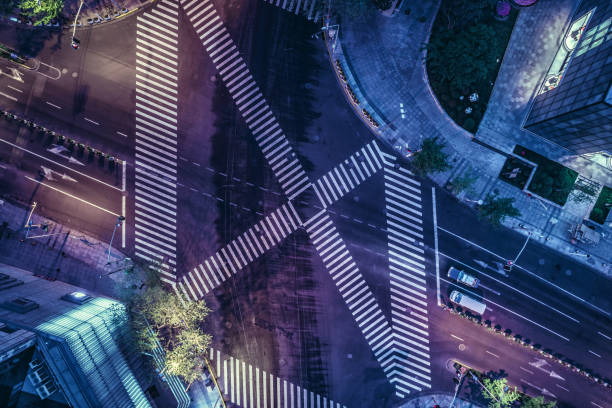 istock Aerial drone view on city intersection during night 1020448432
