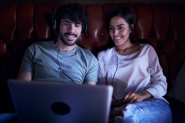 istock Young couple watching a movie on a laptop. 1020456148