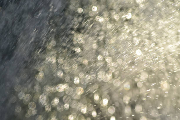 istock Splashing water shining in the blurry light. 1020456744