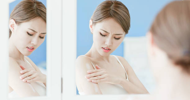 istock woman scratching her arm 1020464512