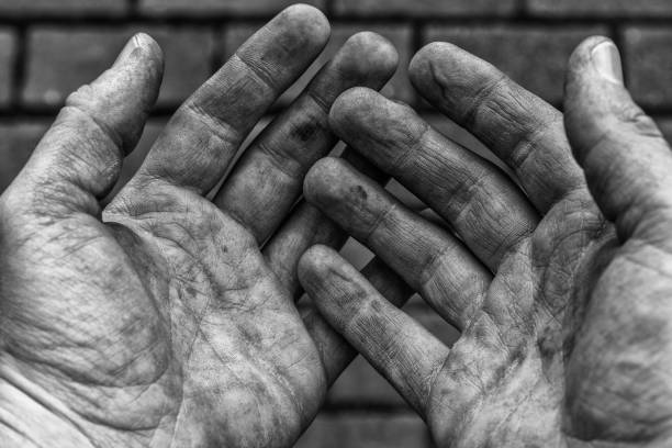 istock Hard working dirty hands in a black and white shot 1020467692