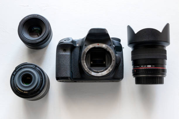 istock DSLR photo camera and lens on a white background closeup 1020468540