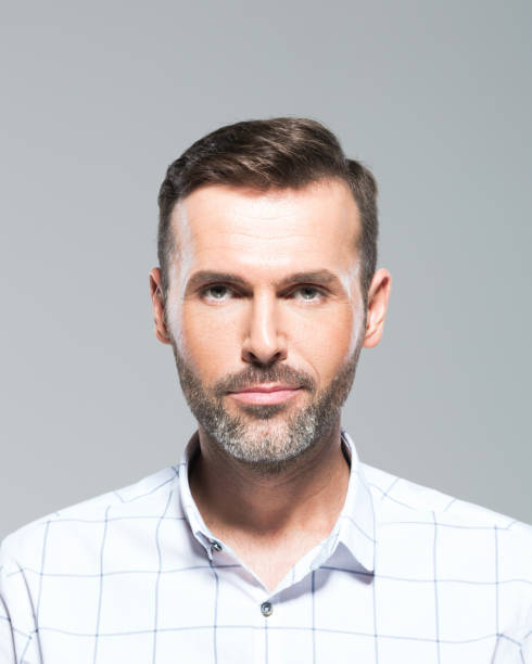 istock Handsome mid adult man staring at camera 1020474318