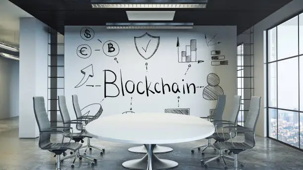 Photo of Conference room with blockchain sketch