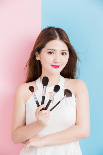 istock pretty girl take makeup brush 1020483982