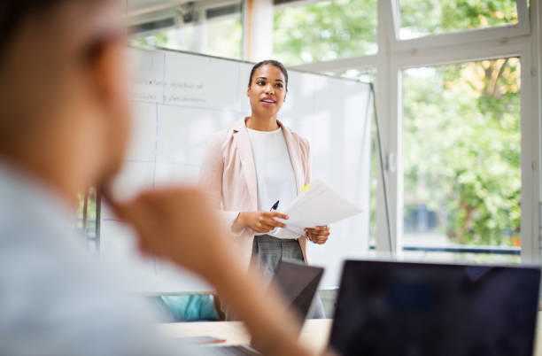 istock Entrepreneur sharing new ideas with team 1020484958