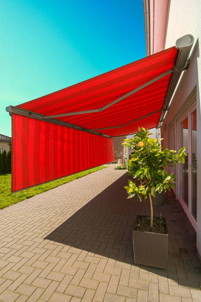 huge awning for privacy and sun protection - window sun sunlight vertical imagens e fotografias de stock