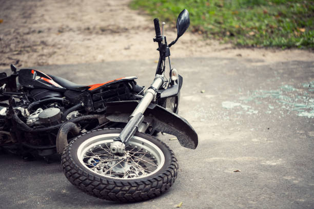 istock Broken motorcycle on the road after traffic incident 1020497846