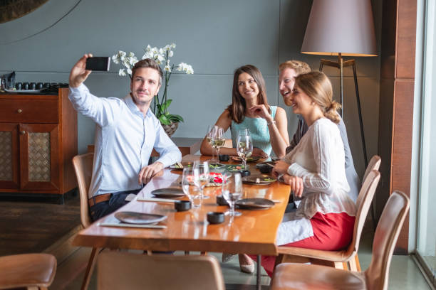 istock Coworkers taking selfie at lunch 1020502174