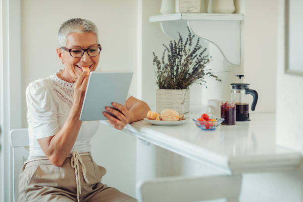 istock Senior Woman Having Breakfast At Home 1020508162