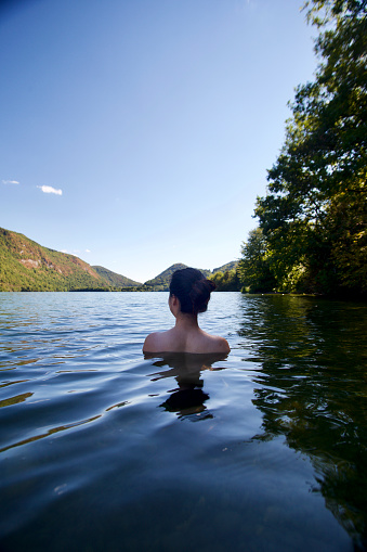Female solo traveler in France rural areas. River l'Ain, Lac de Nantua lake, View of Alps and Chamonix - Mont blanc.