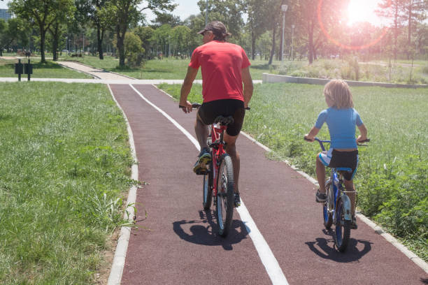 istock Family cycling outdoors in summer 1020515550