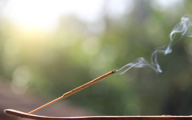 istock Incense stick and smoke from incense burning. Beautiful smoke. Blurred background and design with copy space 1020515572