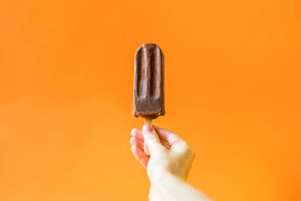 istock Chocolate ice cream on a bright orange background. 1020522362