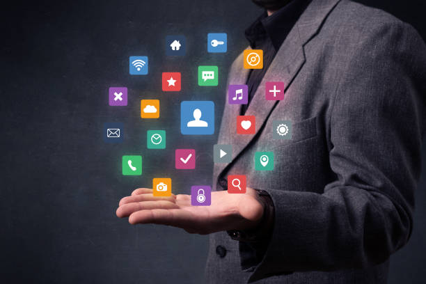 istock Businessman holding colorful applications 1020522764