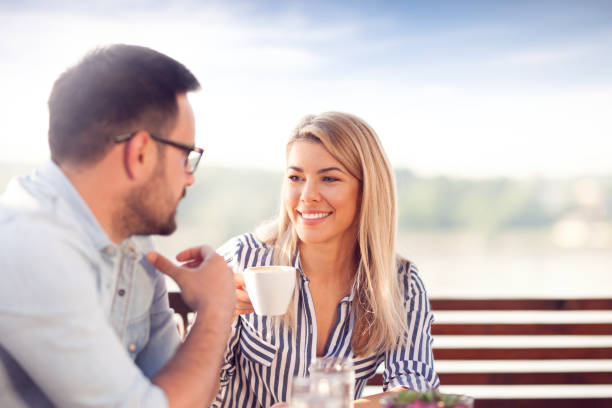 istock Young smiling couple drinking coffee 1020527514