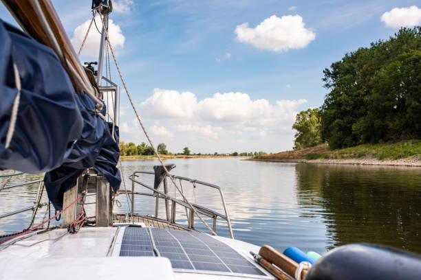 Travel with the sailboat on the Elbe river,  looking over the deck