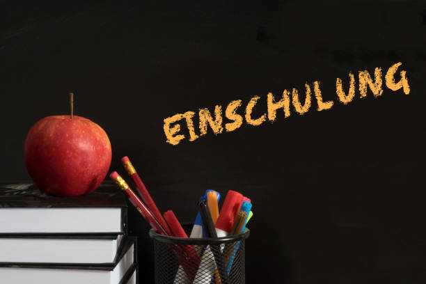 schoolbooks, pens, apples and schooling - reading and writing blackboard book elementary school building imagens e fotografias de stock