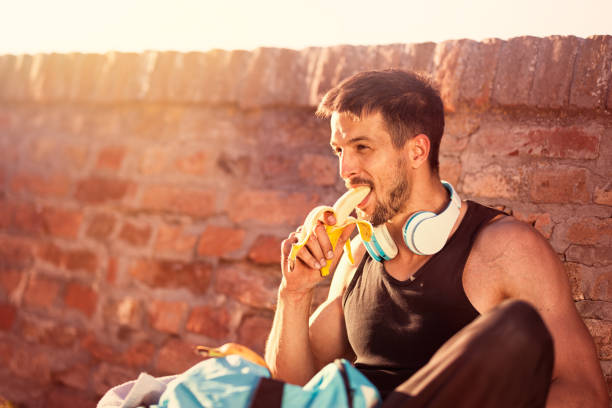 istock Resting with snack after fitness workout and exercising. 1020538030