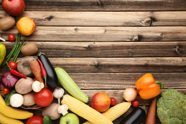 istock Ripe fruits and vegetables on wooden table 1020542490