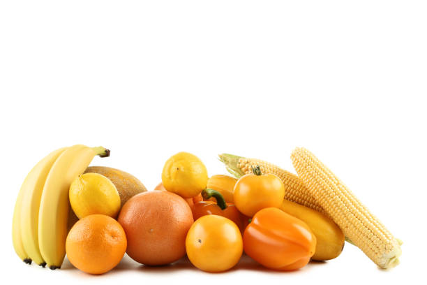 Ripe fruits and vegetables on white background