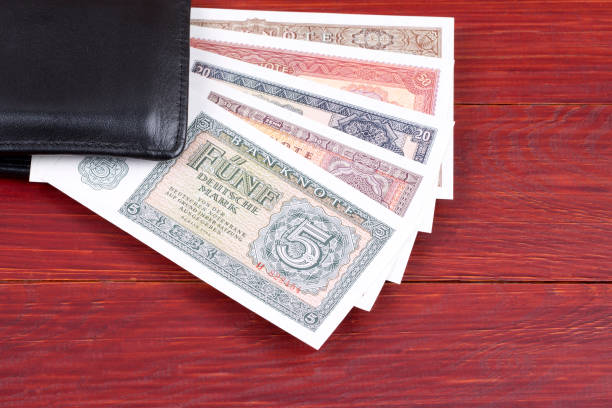 istock Old money from Germany in the black wallet 1020543396
