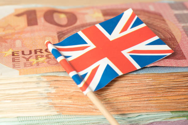 istock Flag of Great Britain and Euro banknotes 1020544250
